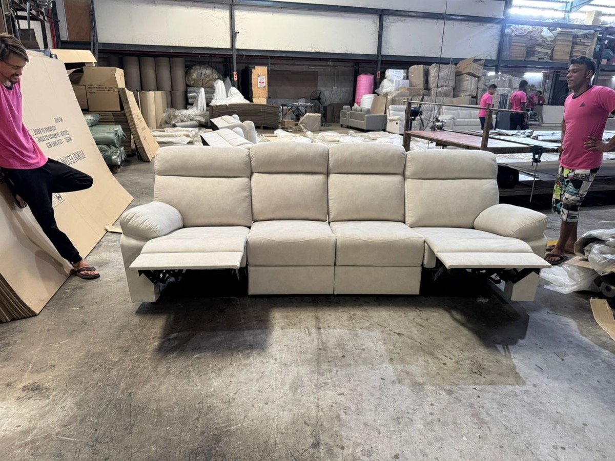 Sofa being quality-checked on the factory floor before shipping to Singapore